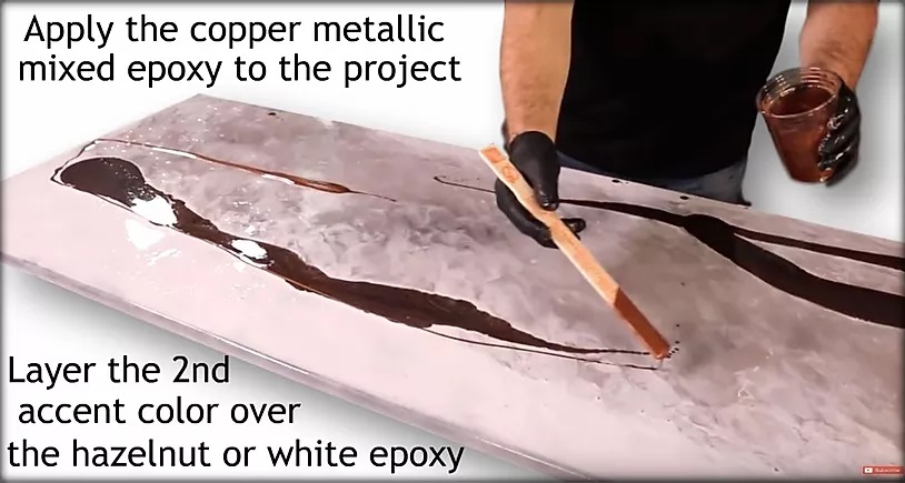 Apply the copper metallic mixed epoxy to the project.