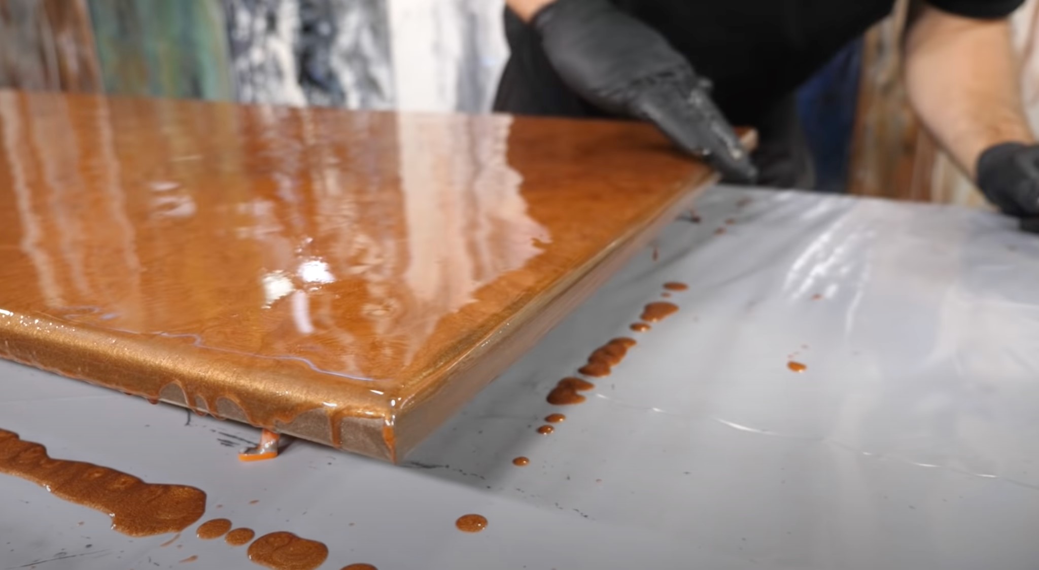 Using a gloved hand to even epoxy